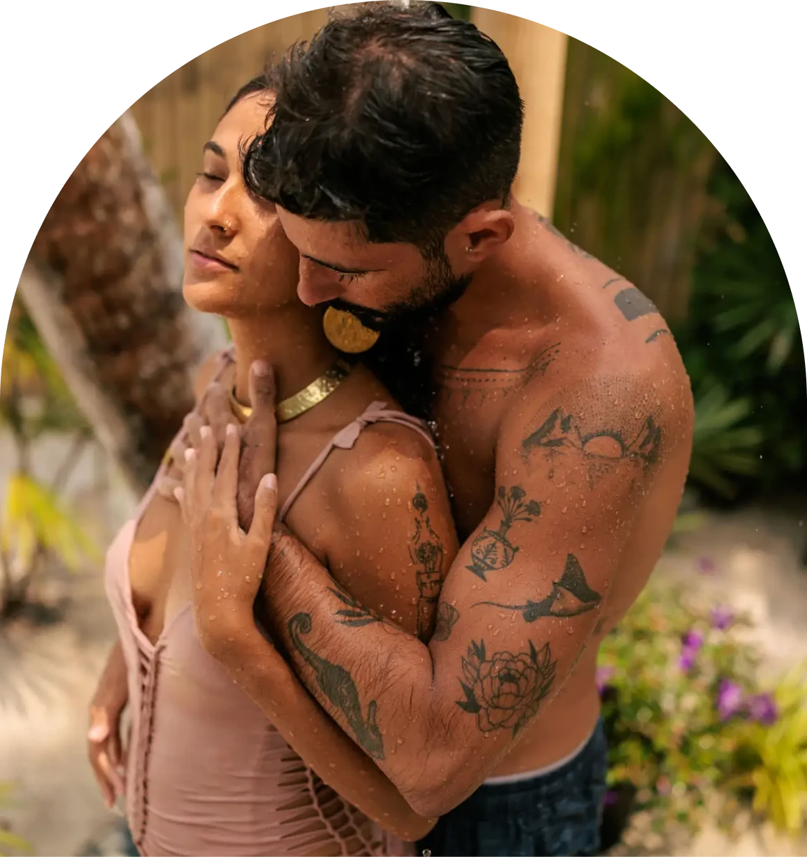 Tattooed couple hugging outdoors